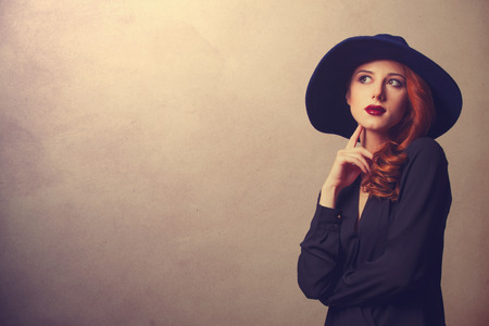 Style redhead women in black on classic backgroundの写真素材