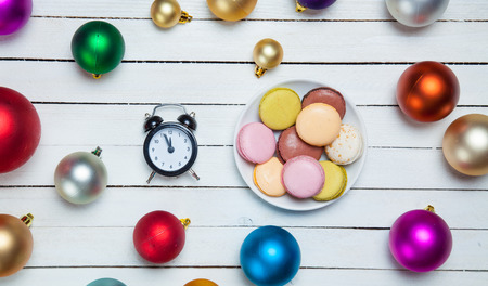 Clock and cookies with christmas toys.の写真素材