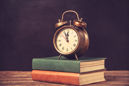 Vintage books and alarm clock.の写真素材