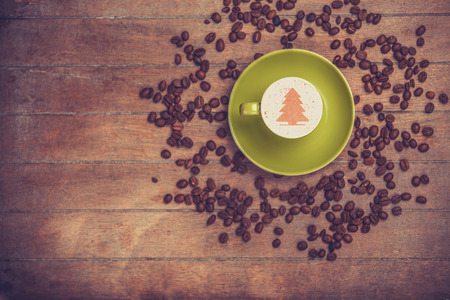 Cup of Ñoffee with shape heart on a wooden table.の写真素材