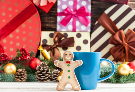 Gingerbread with cup on toys background.の写真素材
