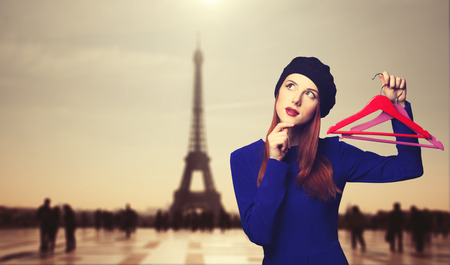 Portrait of beautiful women in blue dress with hanger and bokeh on background.の写真素材