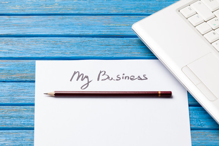 pencil and paper with My Business words near notebook on wooden backgroundの写真素材