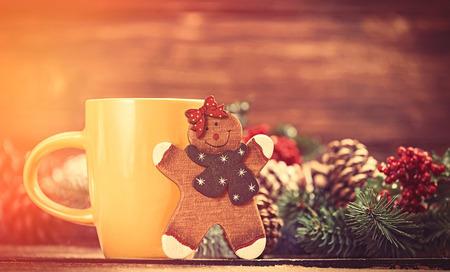 Toy gingerbread and cup of coffeeの写真素材