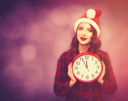 Portrait of a young caucasian girl with Clock