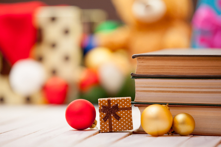 Books with christmas gifts on backgroundの写真素材