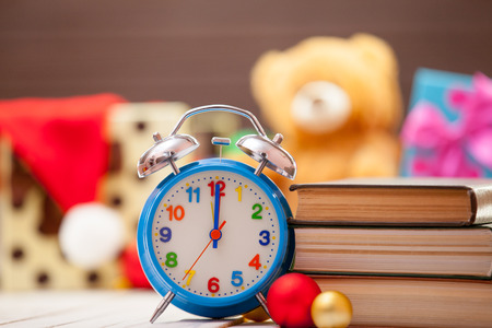 Vintage alarm clock and books on christmas backgroundの写真素材