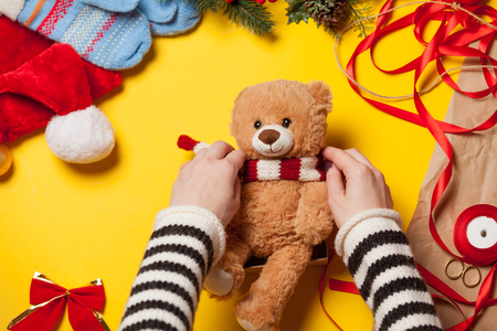 Woman have wrapping a teddy bear toy. High point of viewの写真素材