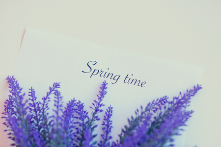 Paper with words Spring time and flower on the tableの写真素材