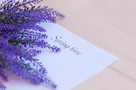 Paper with words Spring time and flower on the tableの写真素材