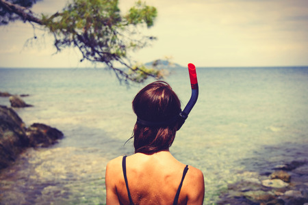 photo of the beautiful young woman in Greece on the sea backgroundの写真素材