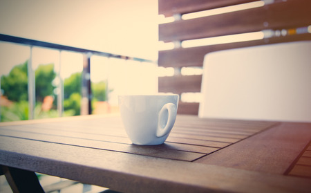 photo of the cup of coffee on the tableの写真素材