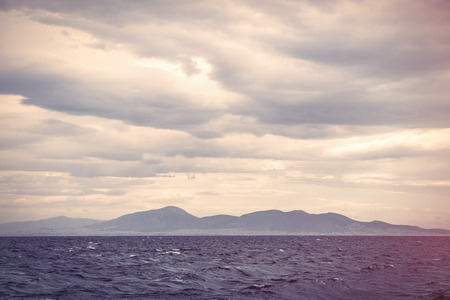 photo of the sea in Greece on the mountain backgroundの写真素材