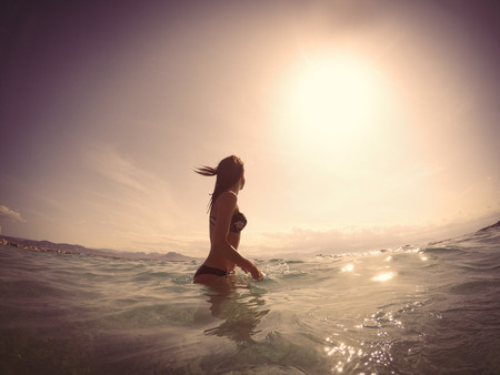 photo of the beautiful young woman in the sea in Greeceの写真素材