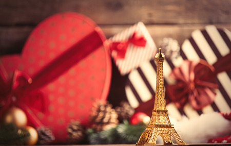 photo of the eiffel tower shaped toy on the christmas decorations backgroundの写真素材