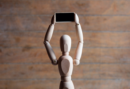 photo of the beautiful gestalta with little board on the brown wooden backgroundの写真素材