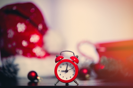 Retro alarm clock and christmas gifts on backgroundの写真素材