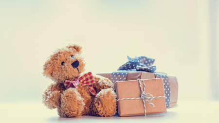 cute teddy bear and beautiful gifts on the wonderful white backgroundの写真素材