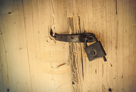 photo of beautiful old lock of the wooden gate doorsの写真素材
