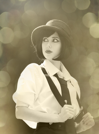 Fashion women in white shirt with tie. Photo in sepia color image style with bokeh lights