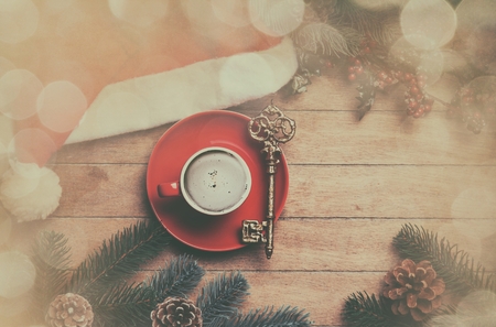 Cappuccino with key on wooden table.の写真素材
