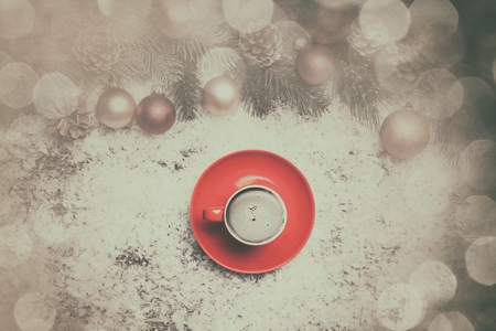Coffee with pine branch on artificial background.の写真素材