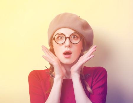 Redhead girl with pigtails on background with bokeh.の写真素材