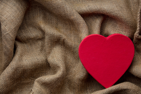 Heart shape box on jute background. Above point of view の写真素材