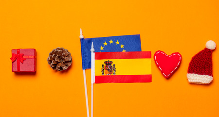 Spain and Europe Union flags with Christmas gifts on orange backgroundの写真素材