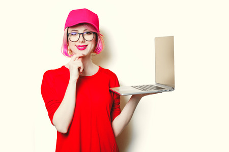 portrait of beautiful smiling young woman with laptopの写真素材