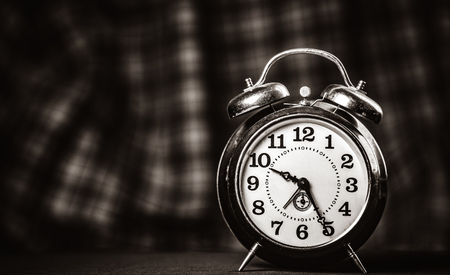 Retro alarm clock. Image in black and white color style