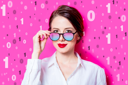 Beautiful businesswoman with binary code on pink background