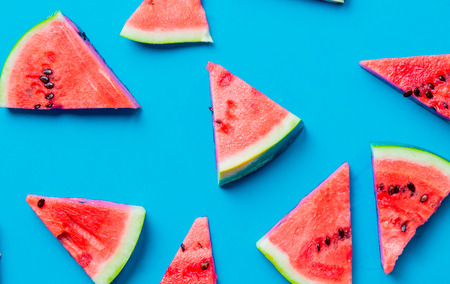 Above view at watermelon cut parts on blue backgroundの写真素材