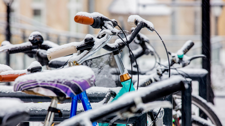 Beautiful style bike in snow after high snowfall in Europe.の写真素材