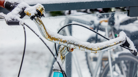 Beautiful style bike in snow after high snowfall in Europe.の写真素材