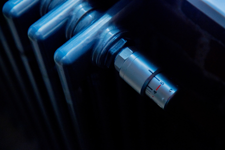 Closeup view at gray metal radiator at house.の写真素材