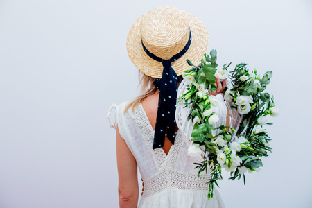Beautiful woman with white roses wreath on white background. Springtime concept or Valentines Day holidayの写真素材