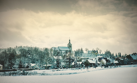 Catholic church in a snow after snowfall in Europe. Januaryの写真素材