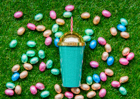 color Chocolate Easter eggs and shake on green spring grassの写真素材