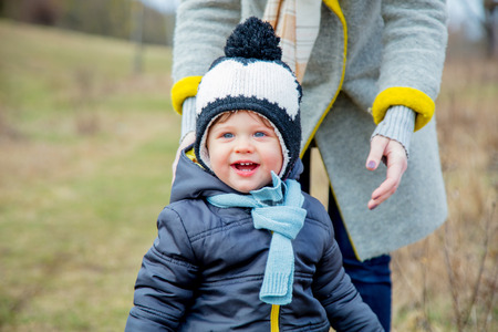 Young mother with toddler boy at outdoor. Spring timeの写真素材