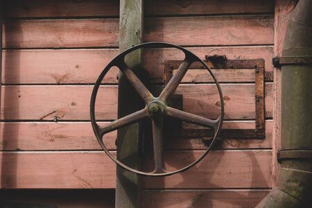 Wheel of old wooden combine harvester of XIX century. Side viewの写真素材