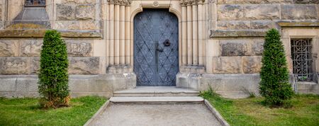 View on vintage door and castle front from a yard side
