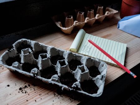 blonde woman in dress near makeup mirrorの写真素材