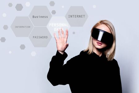 Girl in concept VR glasses work with personal data and informationの写真素材
