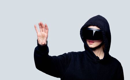 Style woman in concept VR glasses on white backgroundの写真素材