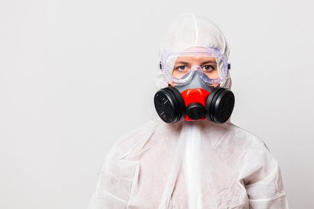 female doctor in protection suit and glasses with mask