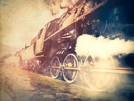 vintage trains with a steam on the move. Photo in old image color styleの写真素材