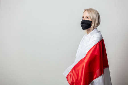 woman in face mask with national Belarus flag on white backgroundの写真素材