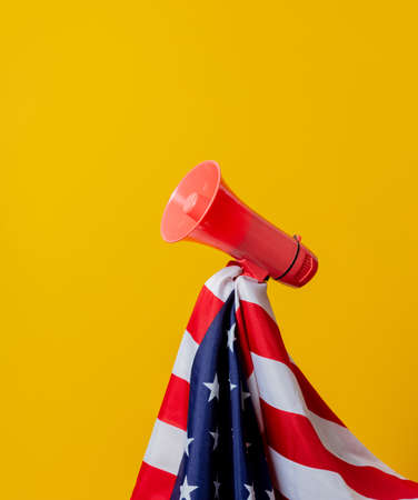 USA flag and megaphone on yellow backgroundの写真素材
