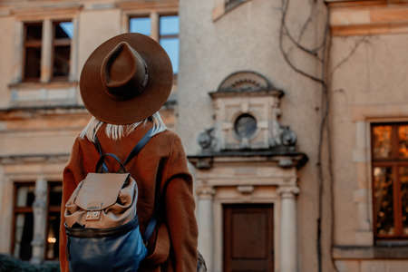 Woman in hat with castle on background in bokehの写真素材